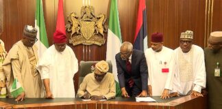 Tinubu Signs Electoral Act 2026 into Law, Manual Transmission Survives as Real-Time Electronic Debate Closes
